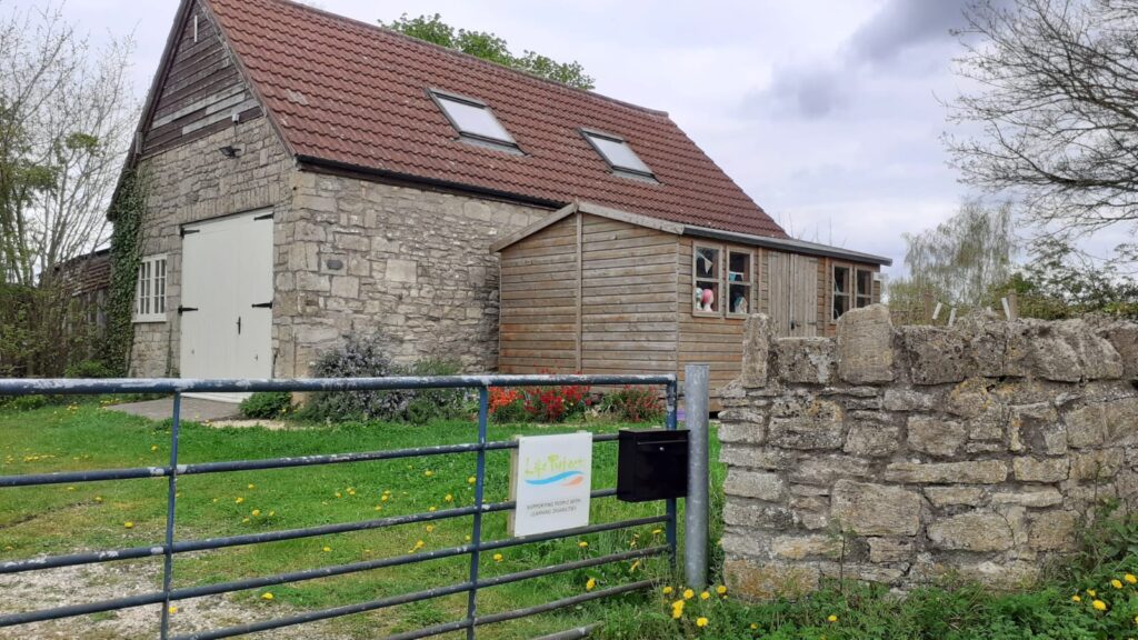 The Old Acorn Barn, viewed from the gate.