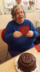 Lady with chocolate cake made using avocado