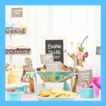 Photo of a bake sale - with an array of baked goods and a sign saying "bake sale"