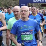 Jerry running in the Bath Half wearing a Life Project T-Shirt and number 6497